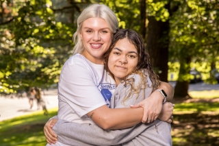 A Great Life Mentor mentor hugging a teenager in a park