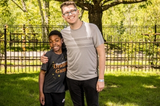 A Great Life Mentor mentor with a child standing in a park
