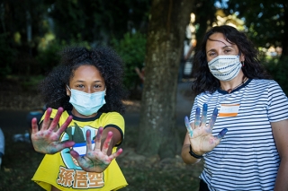 Woman and girl doing tie dye together