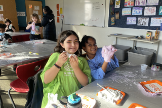 Two kids playing with slime